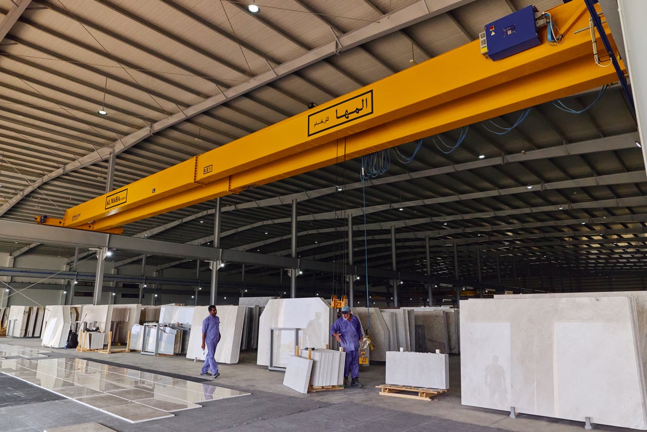Interior view of a gantry crane above stone slabs