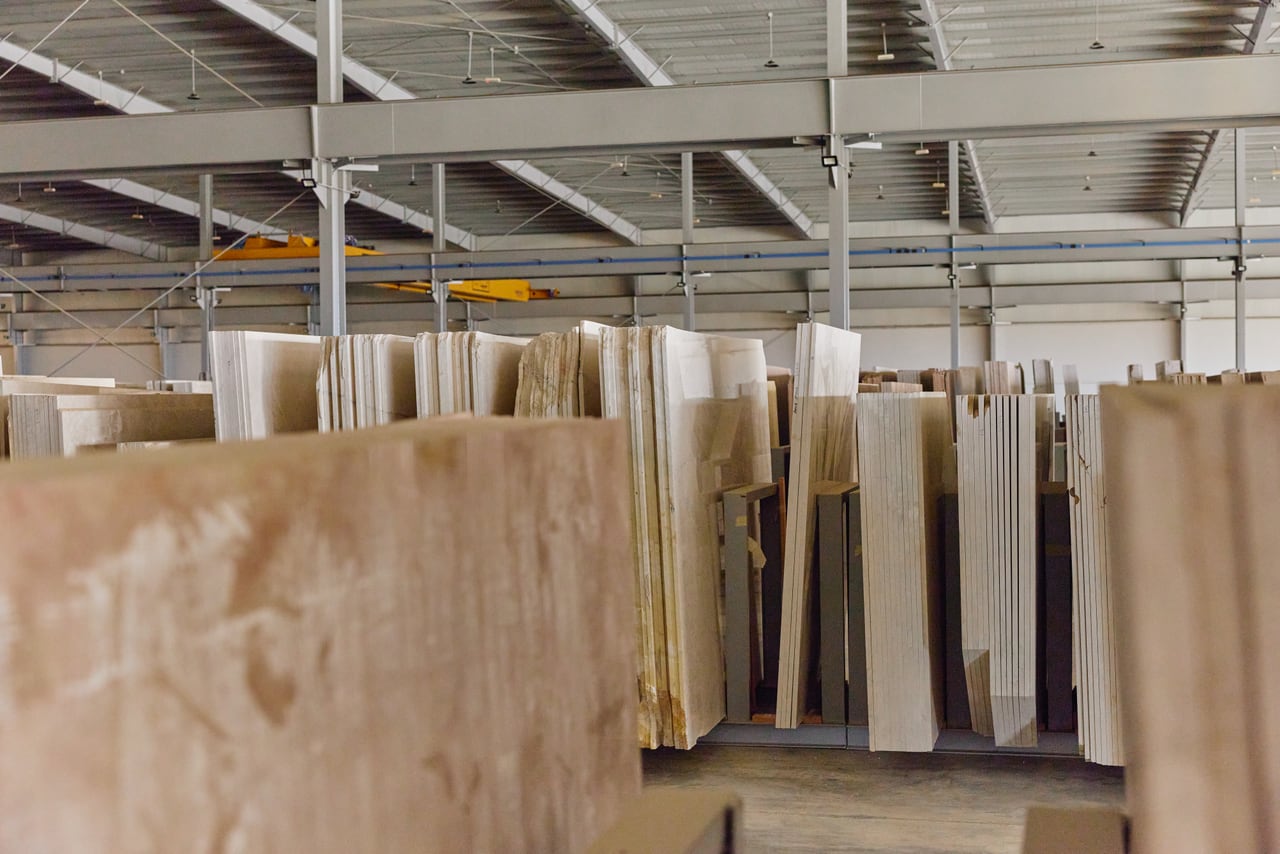 Rows of marble slabs standing in an interior space